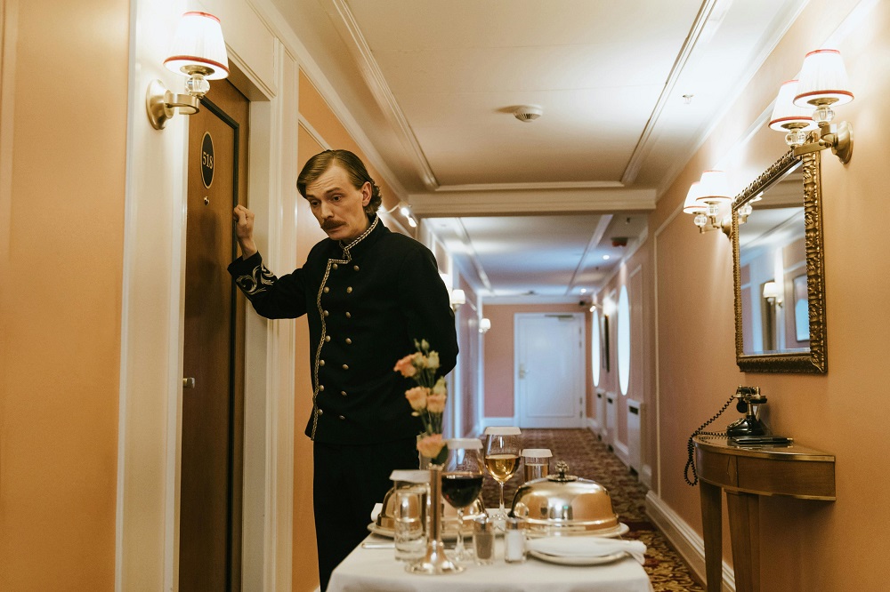 Room service is being provided by hotel attendants. The trolley holds the plates that customers need.