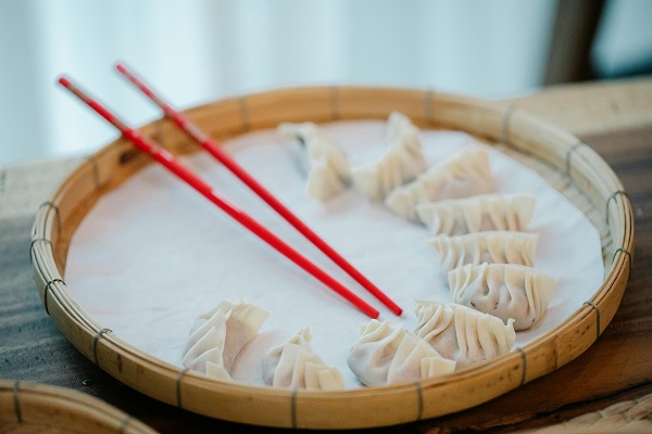 Steam dumplings using a bamboo steamer basket liner.