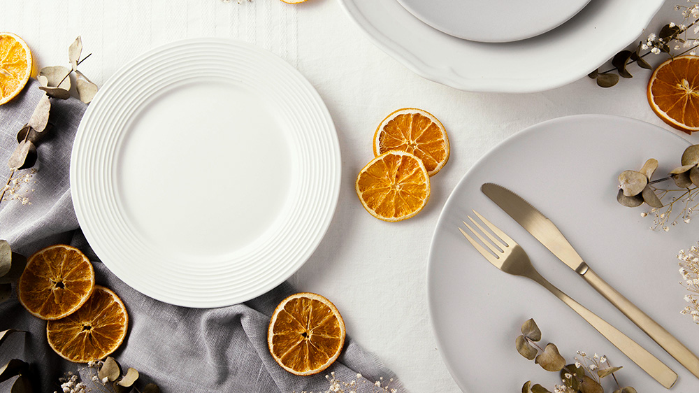 premium porcelain tableware with bronze cutlery