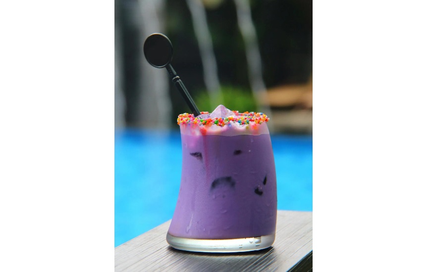 Party specialty drinks and black swizzle stick