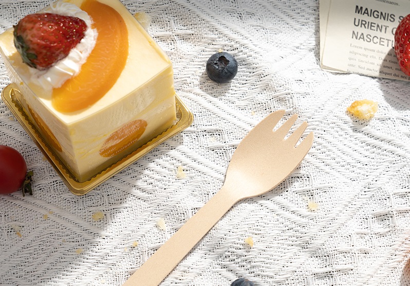 Desserts and disposable dessert forks are placed on the table.