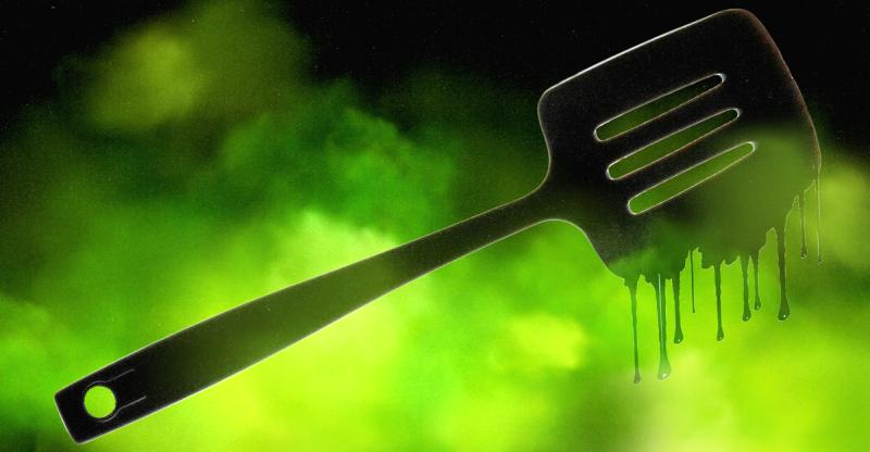 Black plastic spatula that melts when heated.