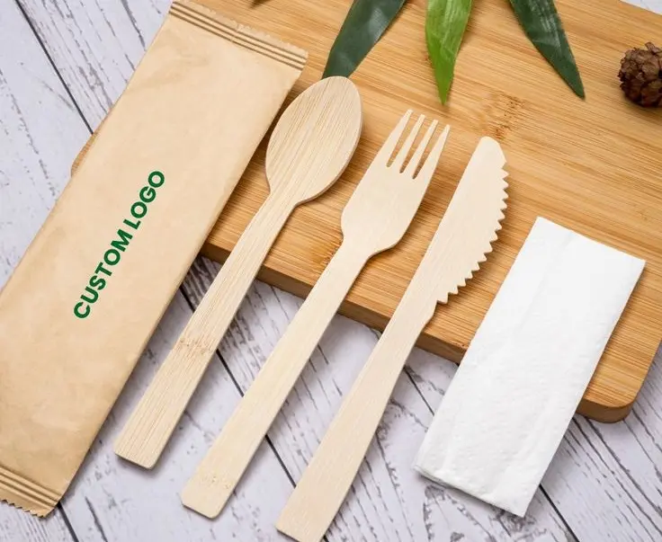 Custom disposable cutlery sets, including knives, forks, spoons, and napkins